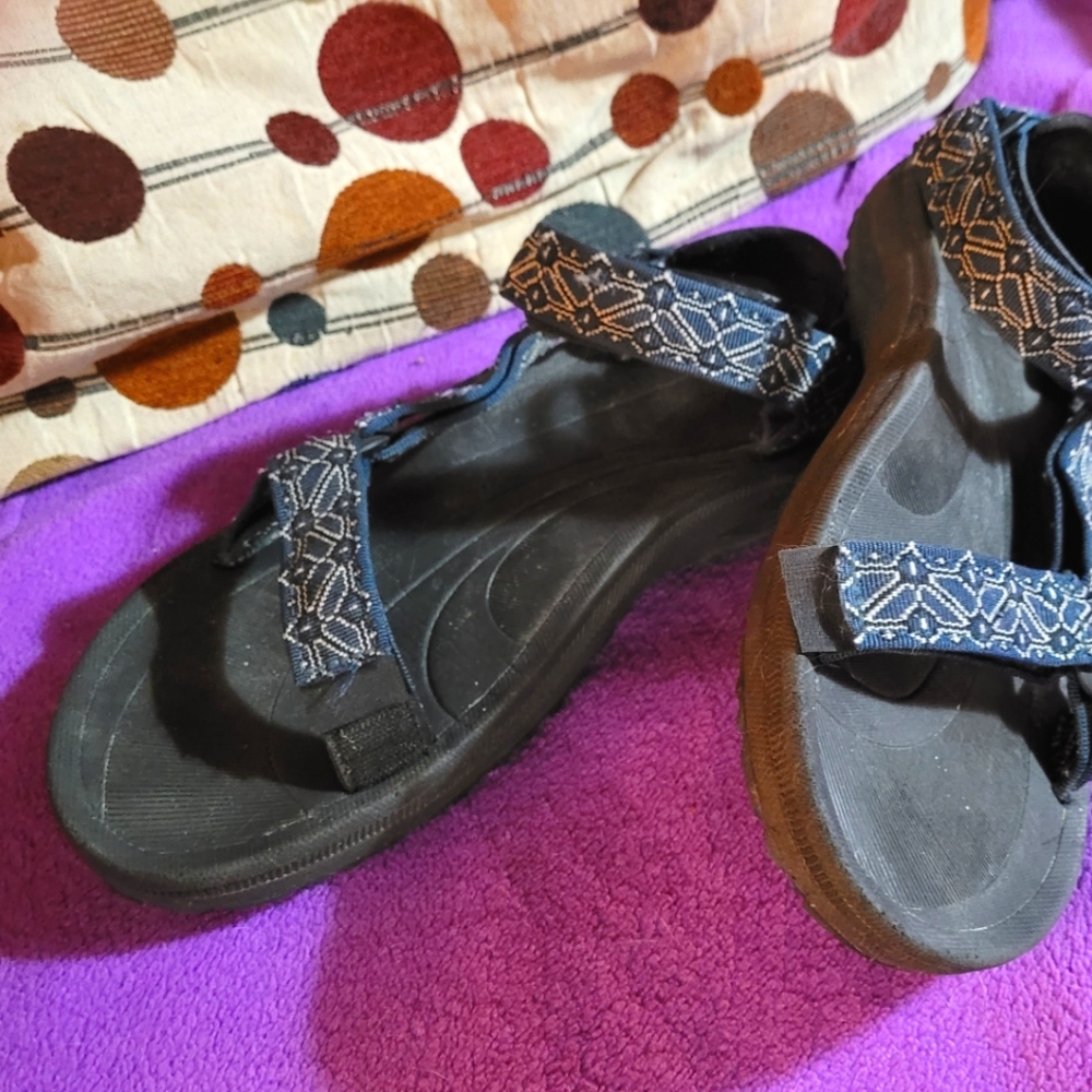Teva Sandals Blue pattern with black soles, size 10 mens but fits woman's 12